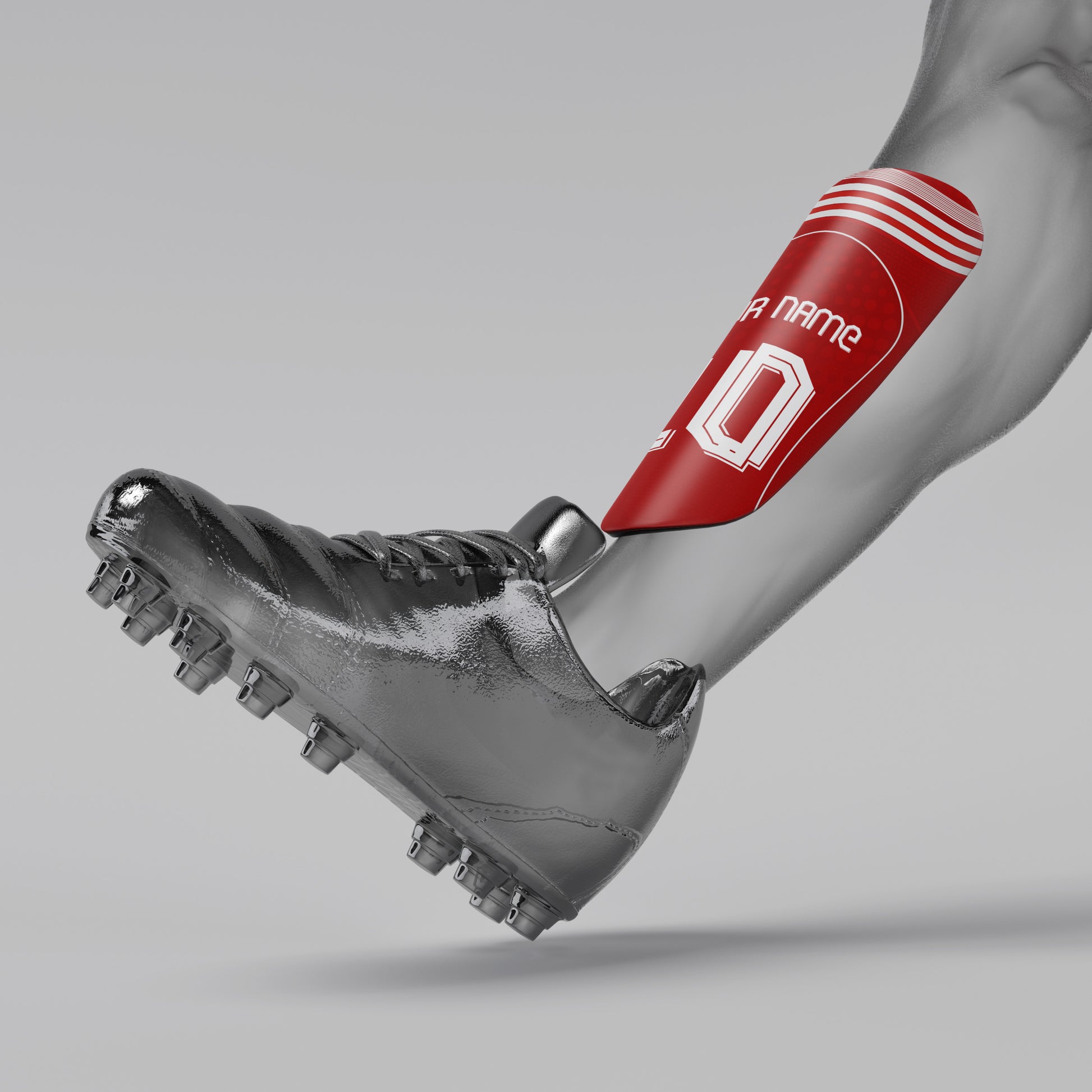 Gray soccer cleat with red shin guard on a gray background