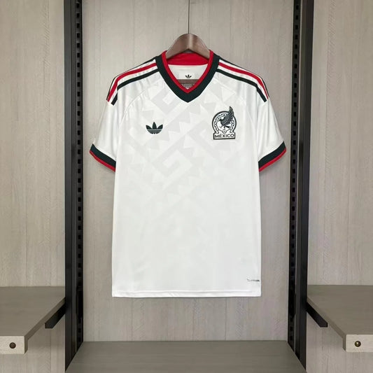 White sports jersey with red and black accents hanging on a rack.