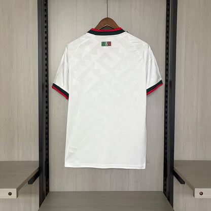 White sports jersey with red and blue accents hanging in a locker room.