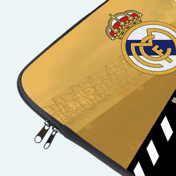 Gold laptop sleeve with a prominent logo on a white background