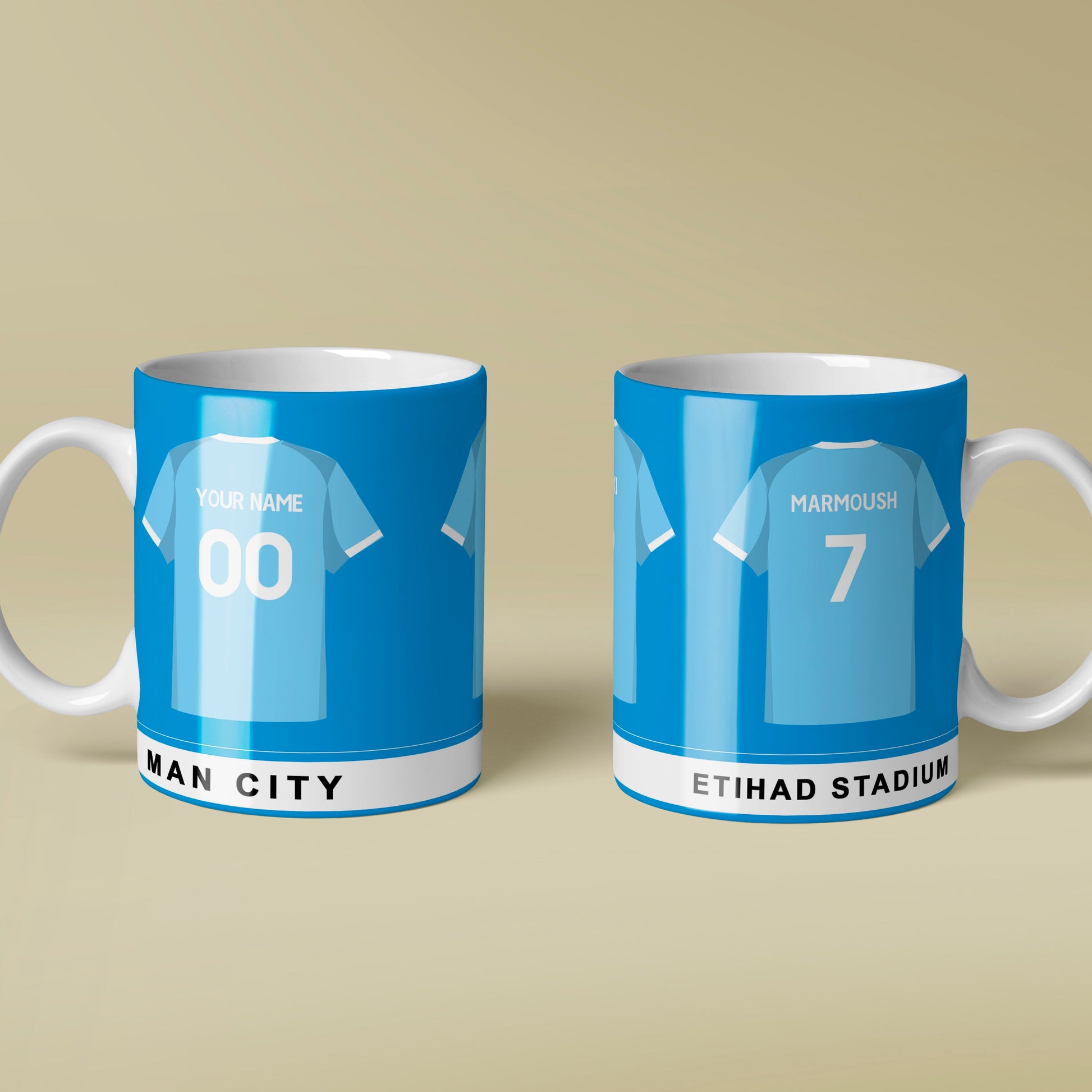 Two blue mugs with Man City branding on a beige background