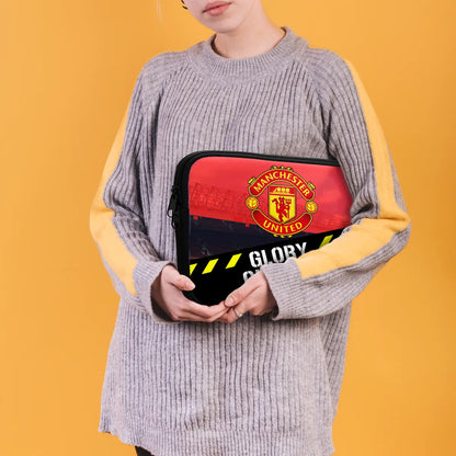 Person holding a Manchester United-themed pouch against a yellow background