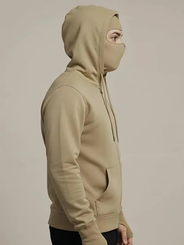 Beige hoodie with face covering on a beige background