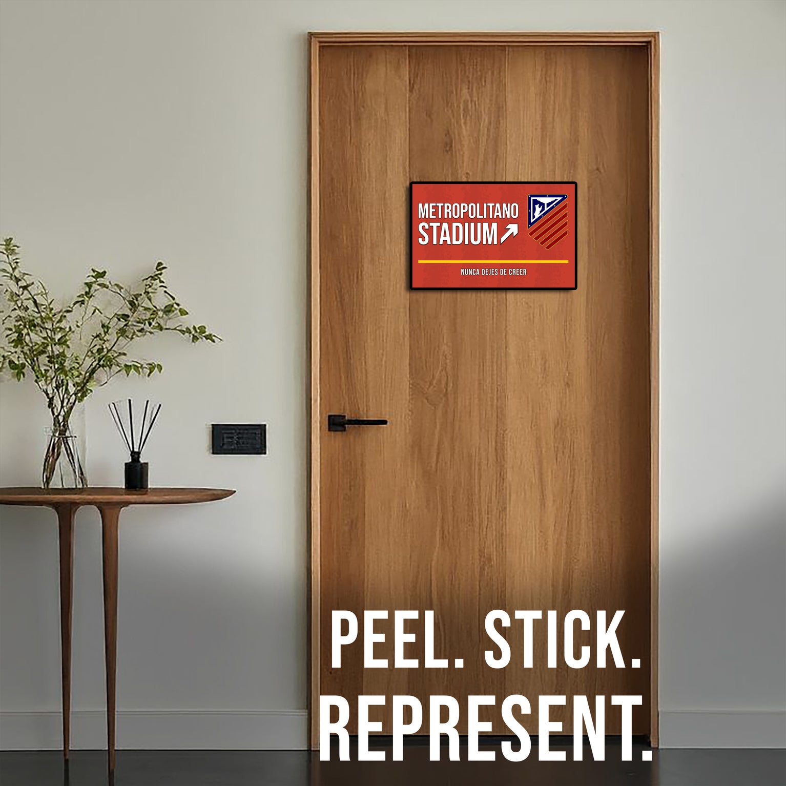 Wooden door with a Metropolitano Stadium sign and 'Peel. Stick. Represent.' text.