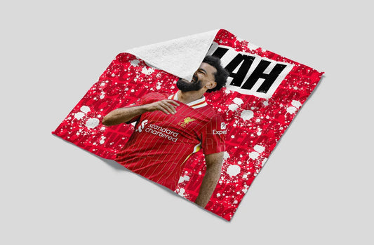 Person wearing a red sports jersey with visible branding on a gray background