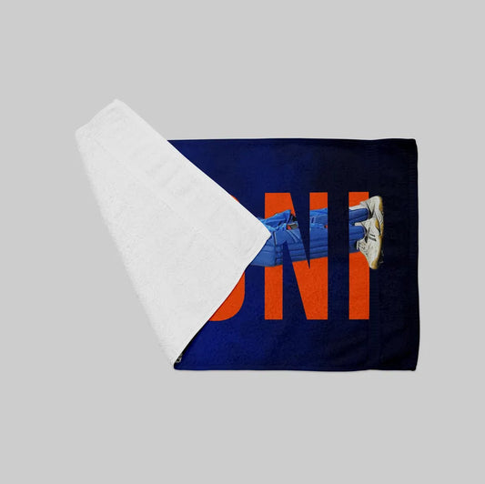 Blue towel with orange text on a gray background