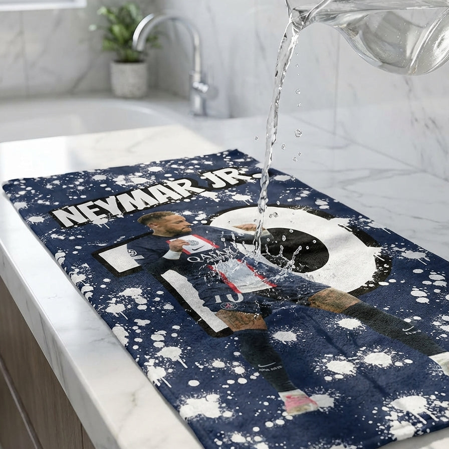 Dishcloth with Neymar Jr. design being washed in a sink