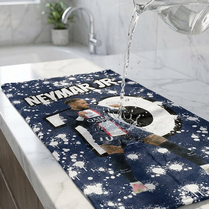 Dishcloth with Neymar Jr. design being washed in a sink