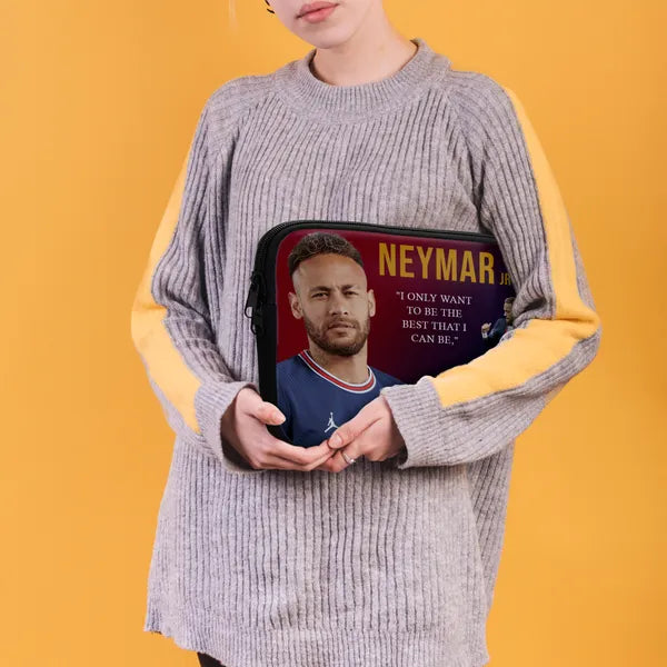 Person holding a pouch with Neymar Jr. image and quote on a yellow background