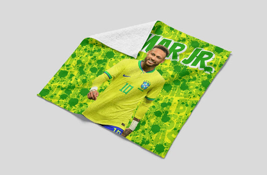Blanket with a soccer player design and 'Mar Jr.' text on a gray background