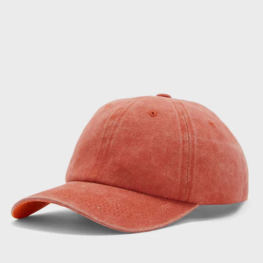 Orange baseball cap on a light gray background
