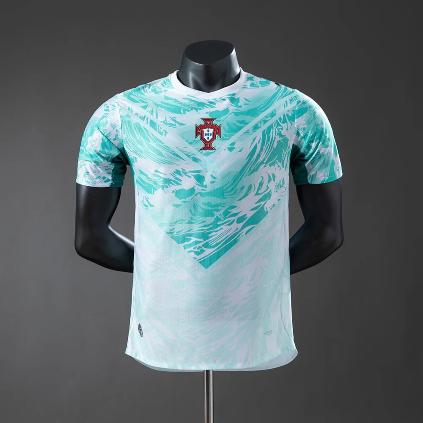 Teal and white sports jersey on a mannequin against a gray background