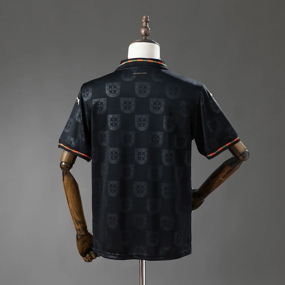 Black patterned shirt on a wooden mannequin against a gray background