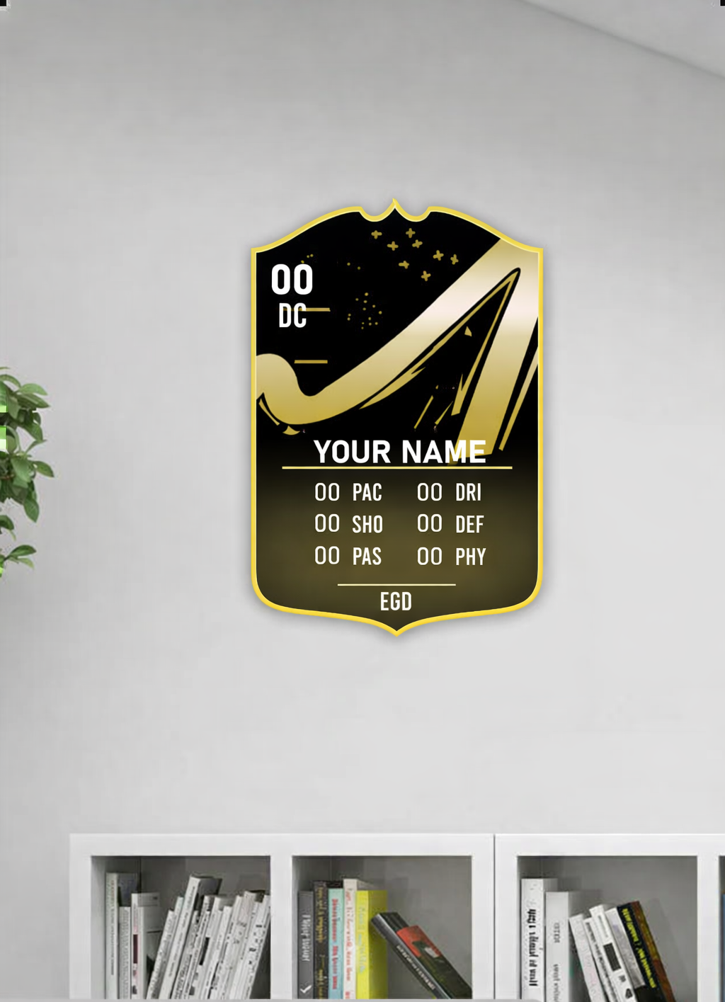 Decorative wall panel with gold design and text on a white wall.