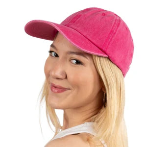 Person wearing a pink baseball cap with a plain background