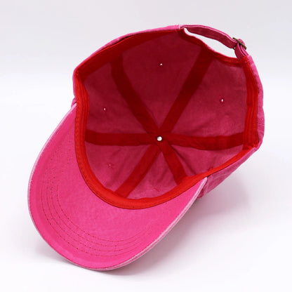 Pink cap with red interior on a white background