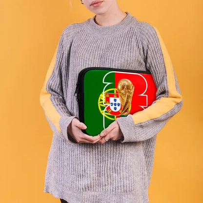 Person holding a laptop case with a design of a flag and a trophy on an orange background