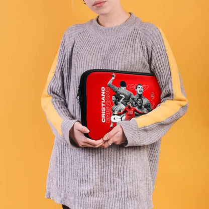 Person holding a red Cristiano Ronaldo branded case against a yellow background