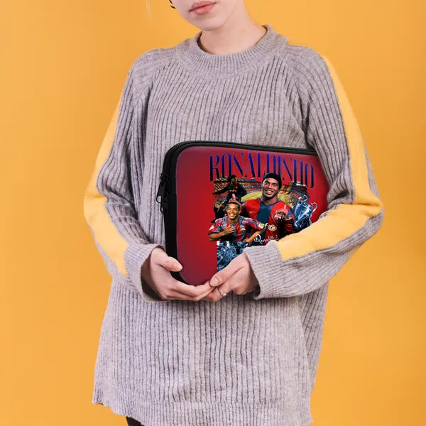 Person holding a red pouch with images and text on a yellow background