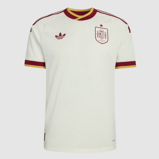 White soccer jersey with red and yellow accents featuring Adidas logo on a white background