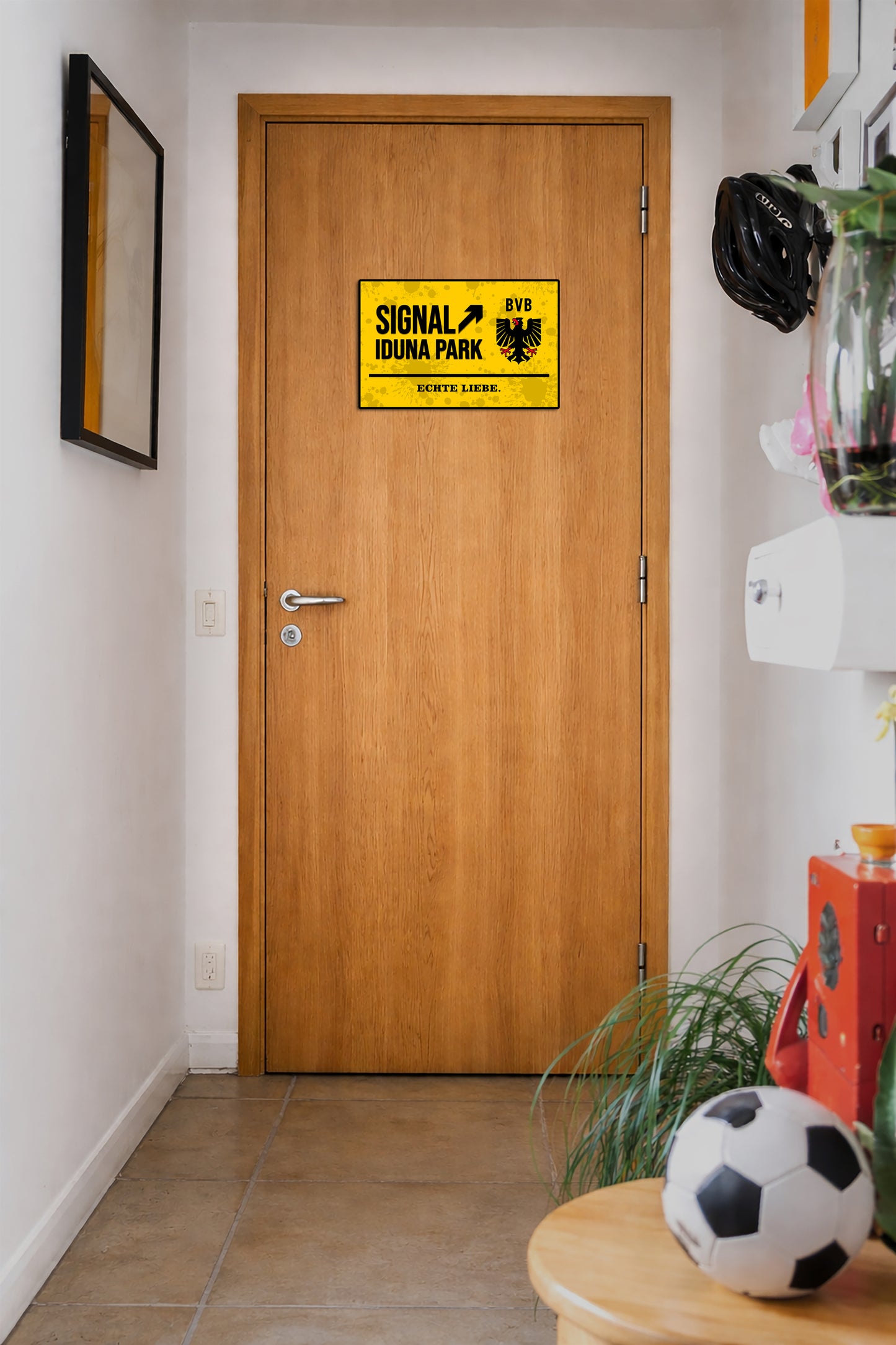 Wooden door with a yellow sign in a hallway