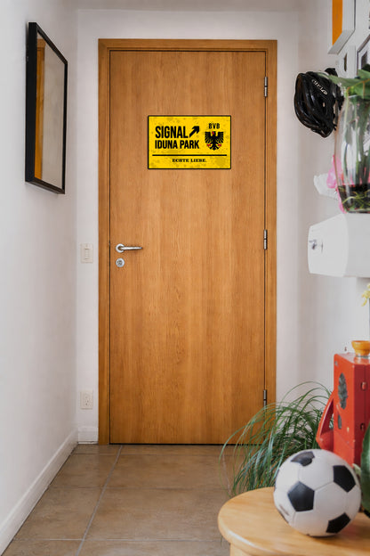 Wooden door with a yellow sign in a hallway