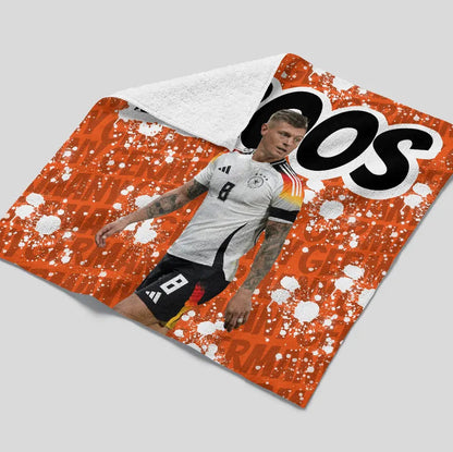 Soccer player on a sports jersey with visible branding on a gray background