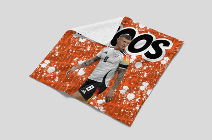 Soccer player on a sports jersey with visible branding on a gray background