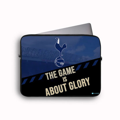 Laptop sleeve with Tottenham Hotspur logo and 'The Game is About Glory' text on a blue and black background.
