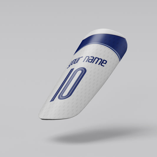 White shin guard with blue accents on a gray background