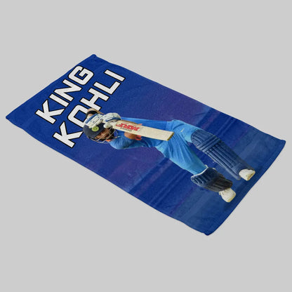 Blue mat with a cricket player and 'King Kohli' text on a gray background