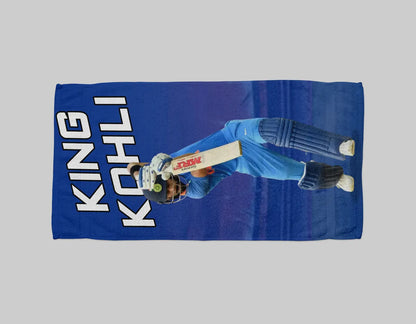 Blue towel with a cricket player graphic and 'King Kohli' text on a gray background