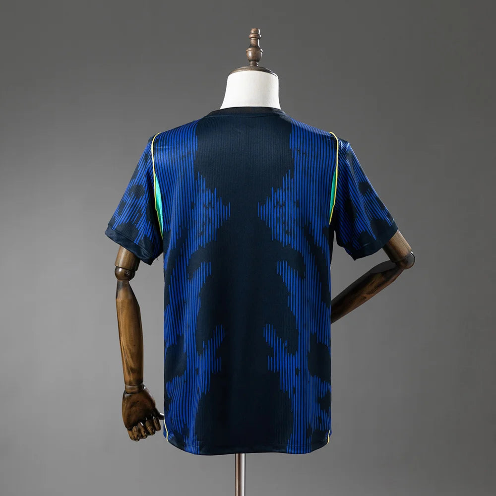 Blue and black patterned shirt on a mannequin against a gray background