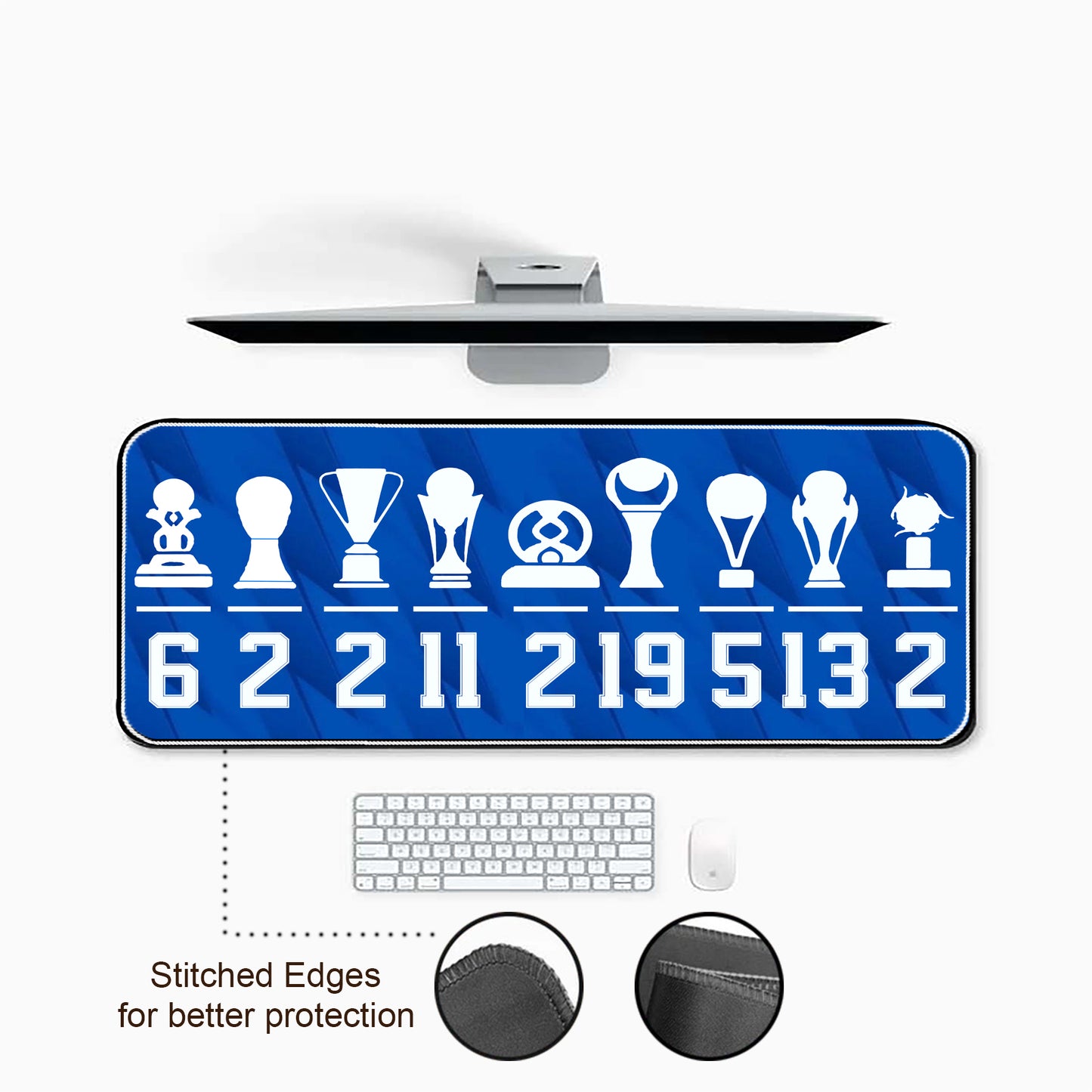 Desk mat with sports trophy and number design, keyboard, and mouse on a white background