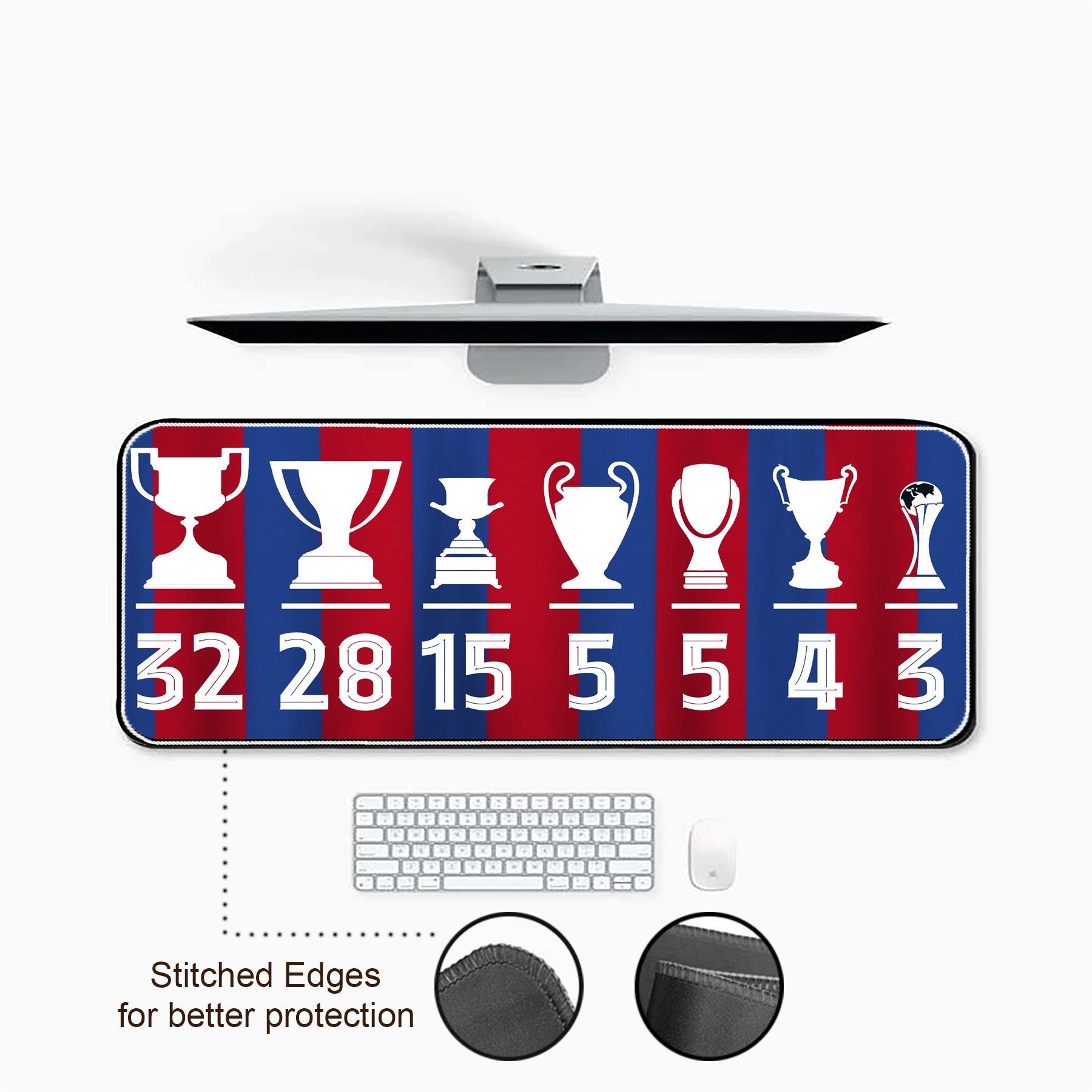 Desk setup with a large mouse pad featuring trophy designs and numbers, keyboard, and mouse on a white background.