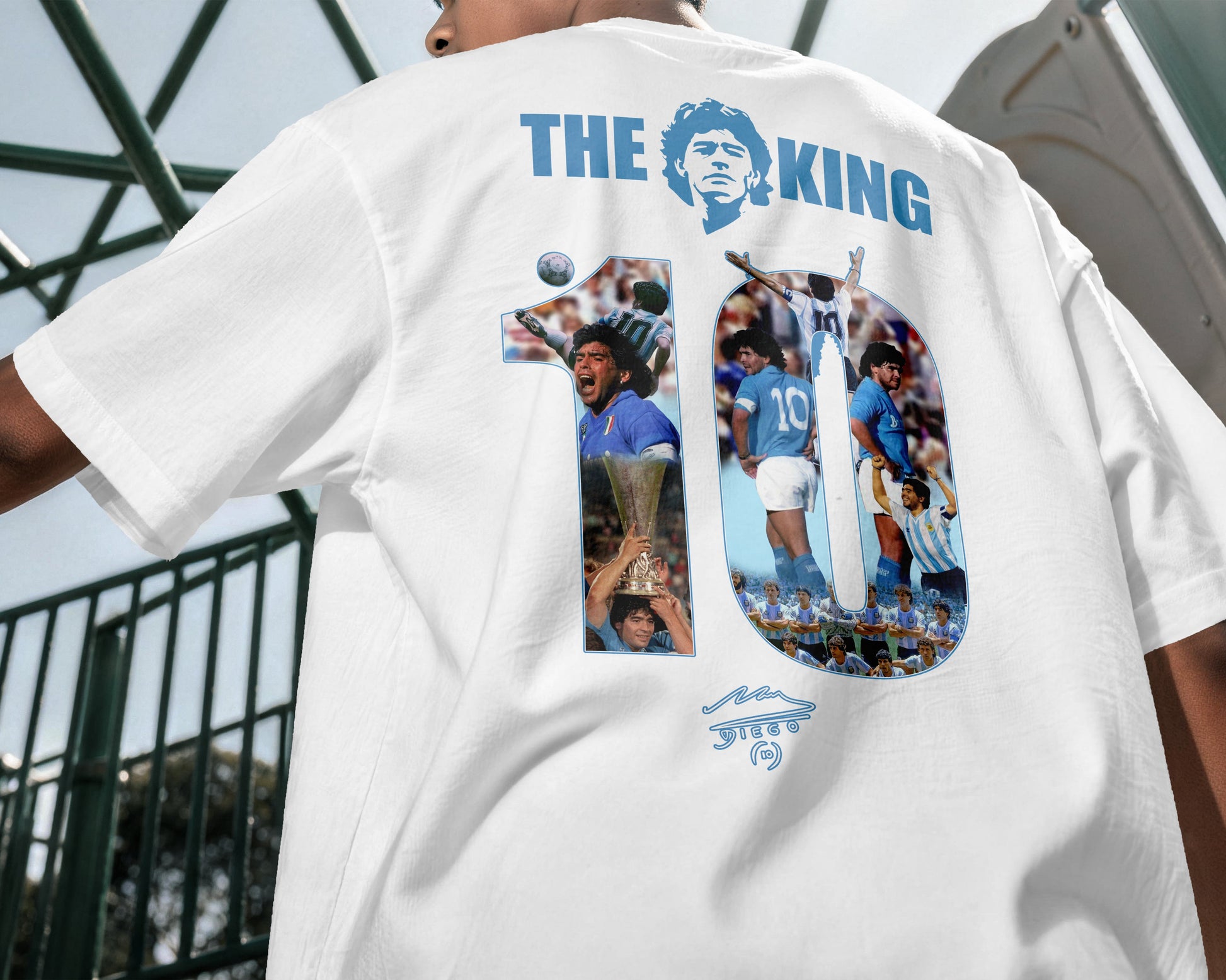 White t-shirt with 'The King' graphic on the back, featuring images of a sports figure and text.