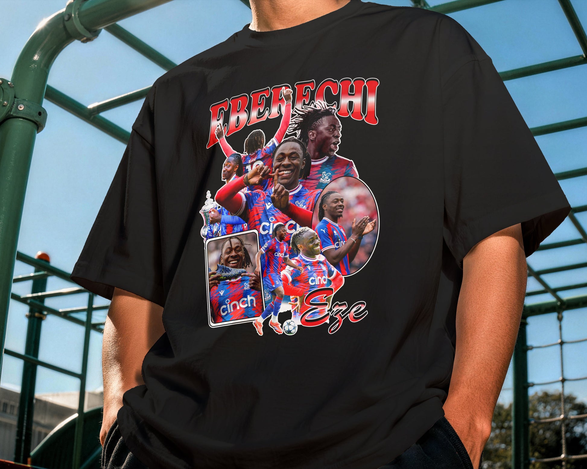 Person wearing a black t-shirt with sports-themed graphics and text.