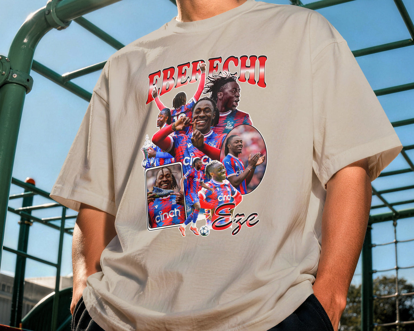 Person wearing a t-shirt with a graphic design and text outdoors