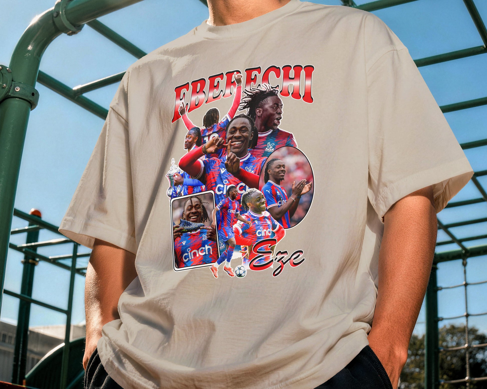 Person wearing a t-shirt with a graphic design and text outdoors