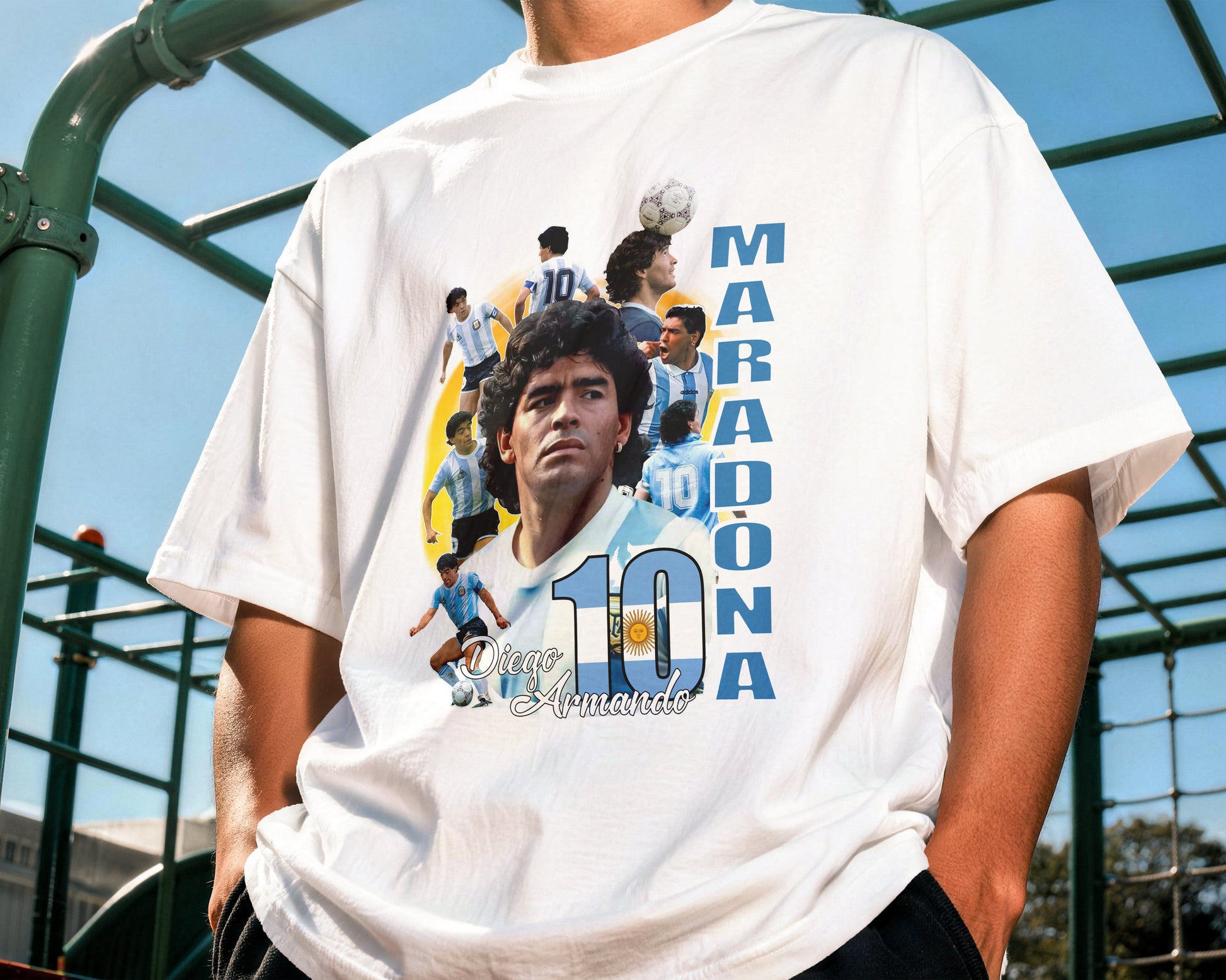 Person wearing a white t-shirt with a graphic of a famous soccer player and the number 10.