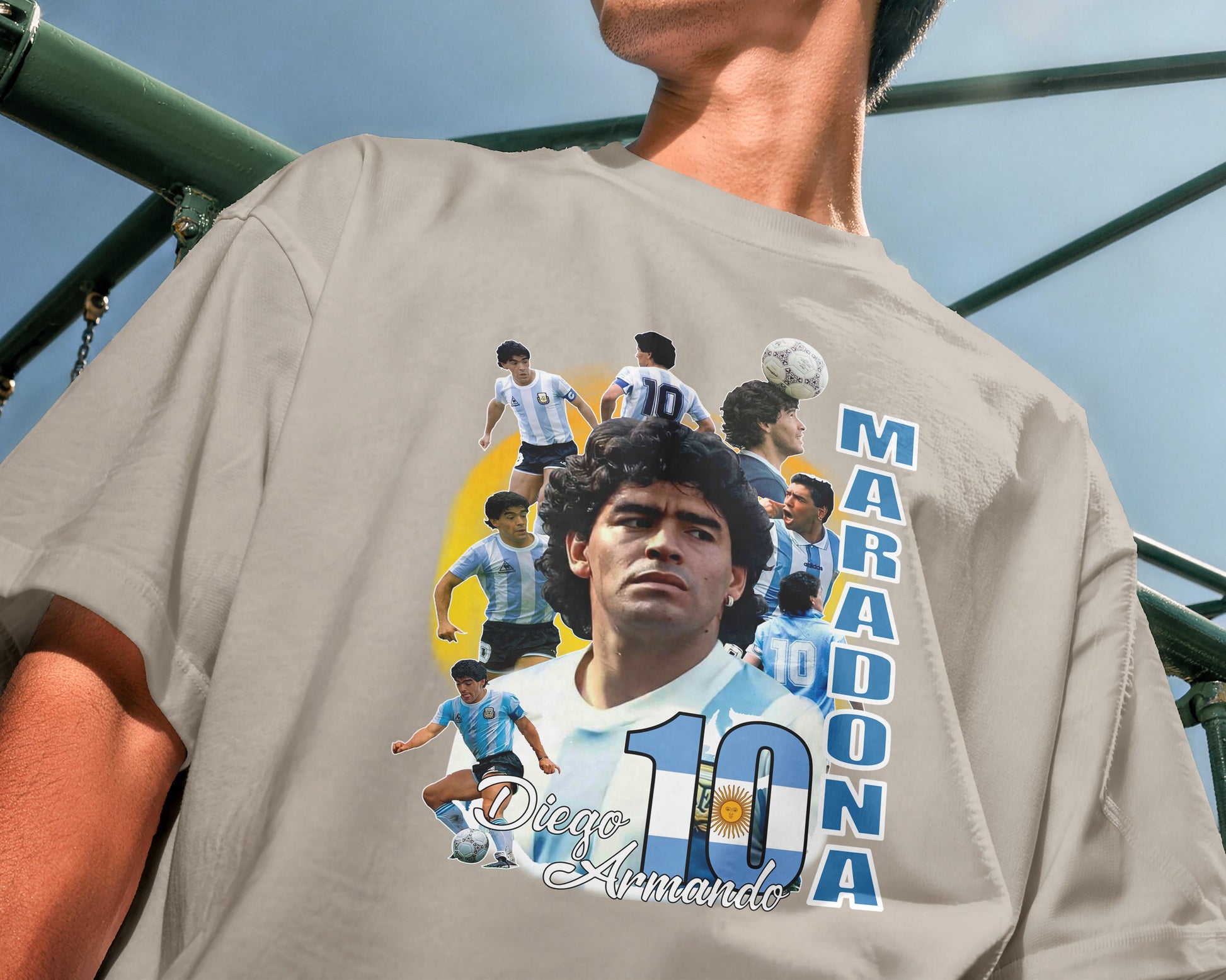 Person wearing a t-shirt with Diego Maradona graphic and text