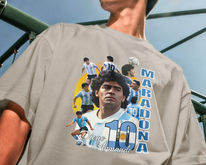 Person wearing a t-shirt with Diego Maradona graphic and text