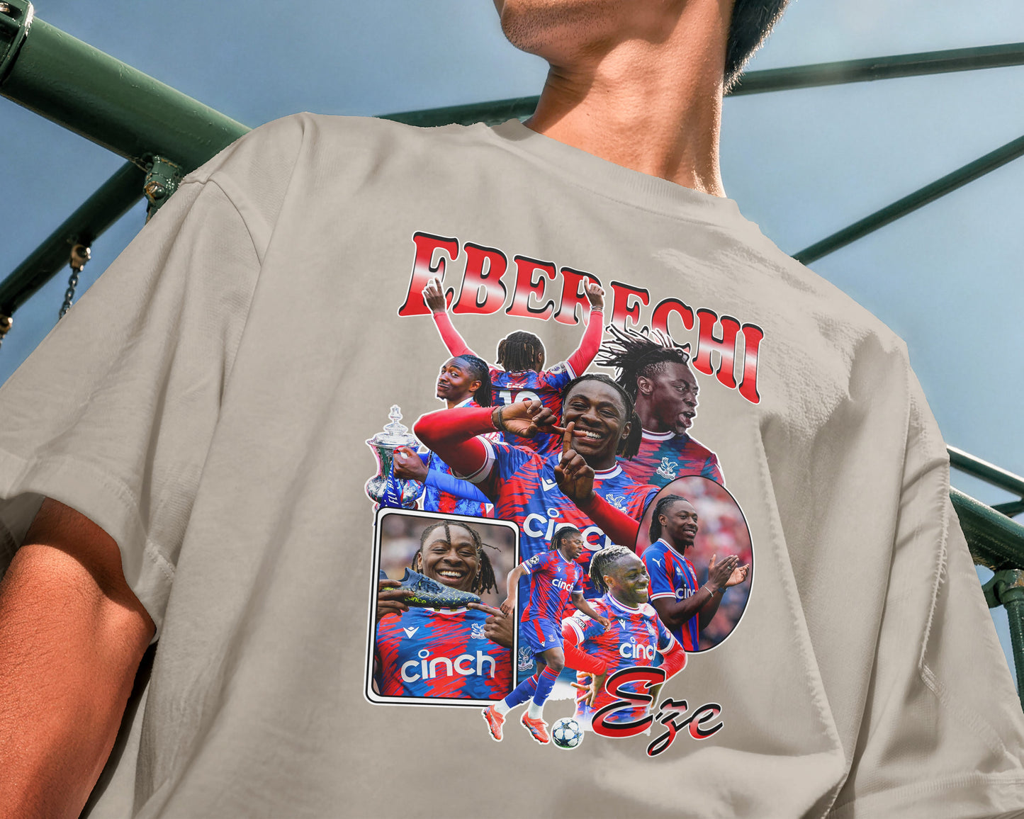 Person wearing a t-shirt with graphic designs and text on the back