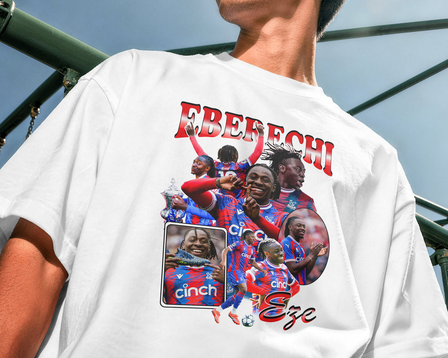 Person wearing a white t-shirt with a graphic design of a football player and text.