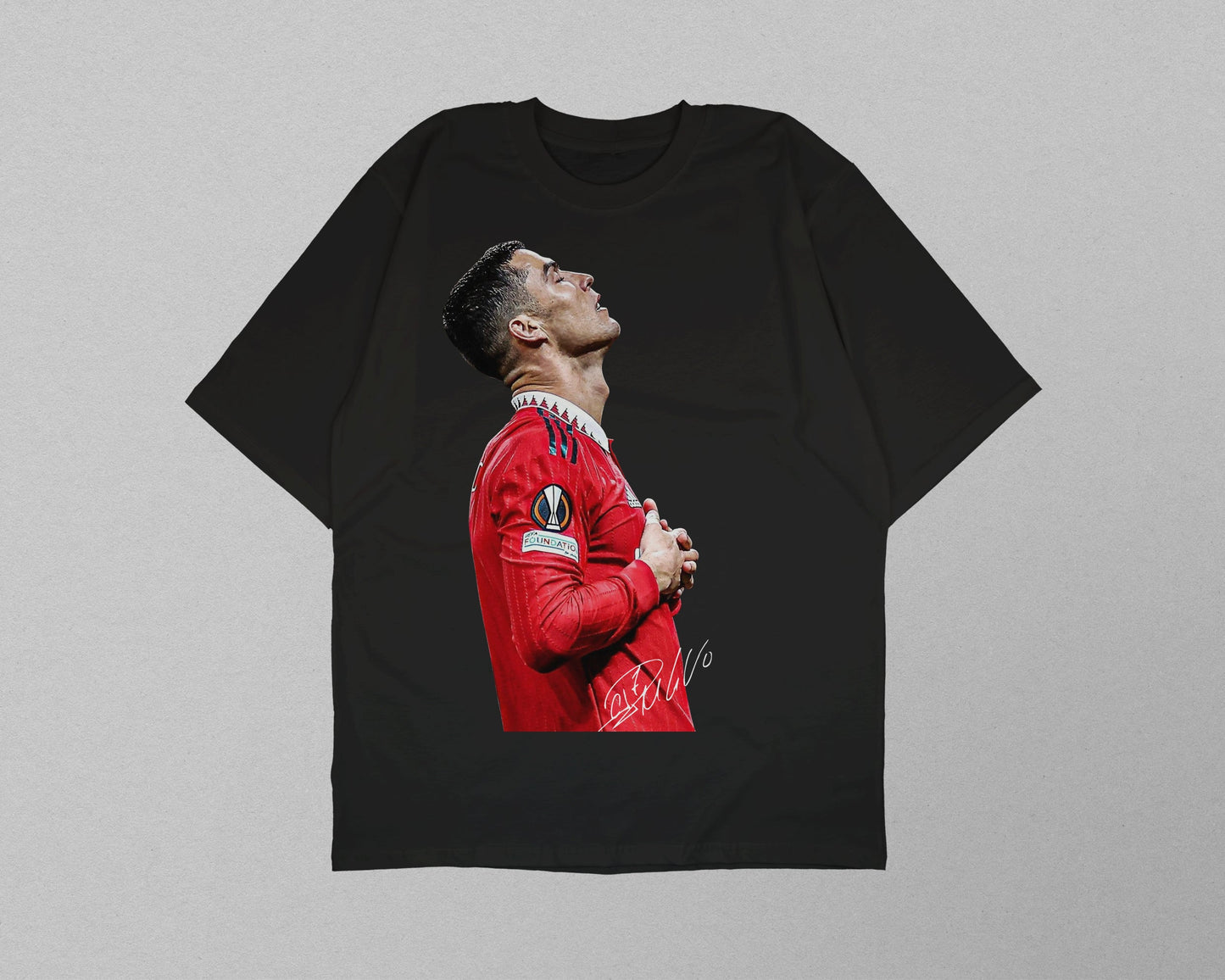 Black t-shirt with a graphic of a person in a red sports jersey on a gray background