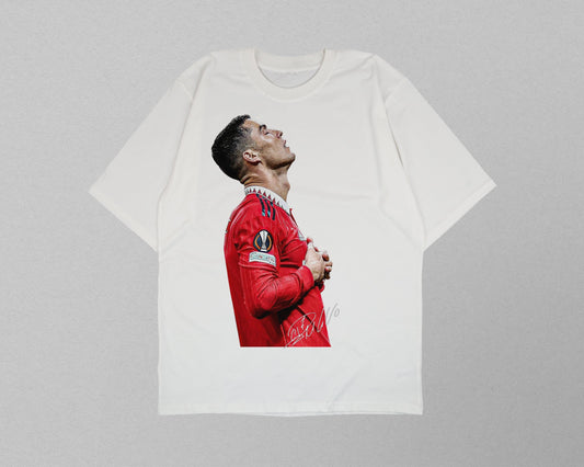 White t-shirt with a printed design of a person in a red sports jersey on a gray background