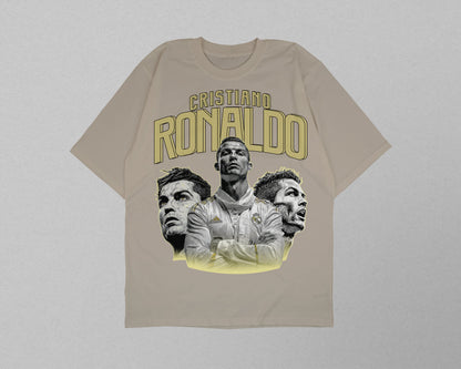 Beige t-shirt with images of a person and 'Cristiano Ronaldo' text on a light gray background
