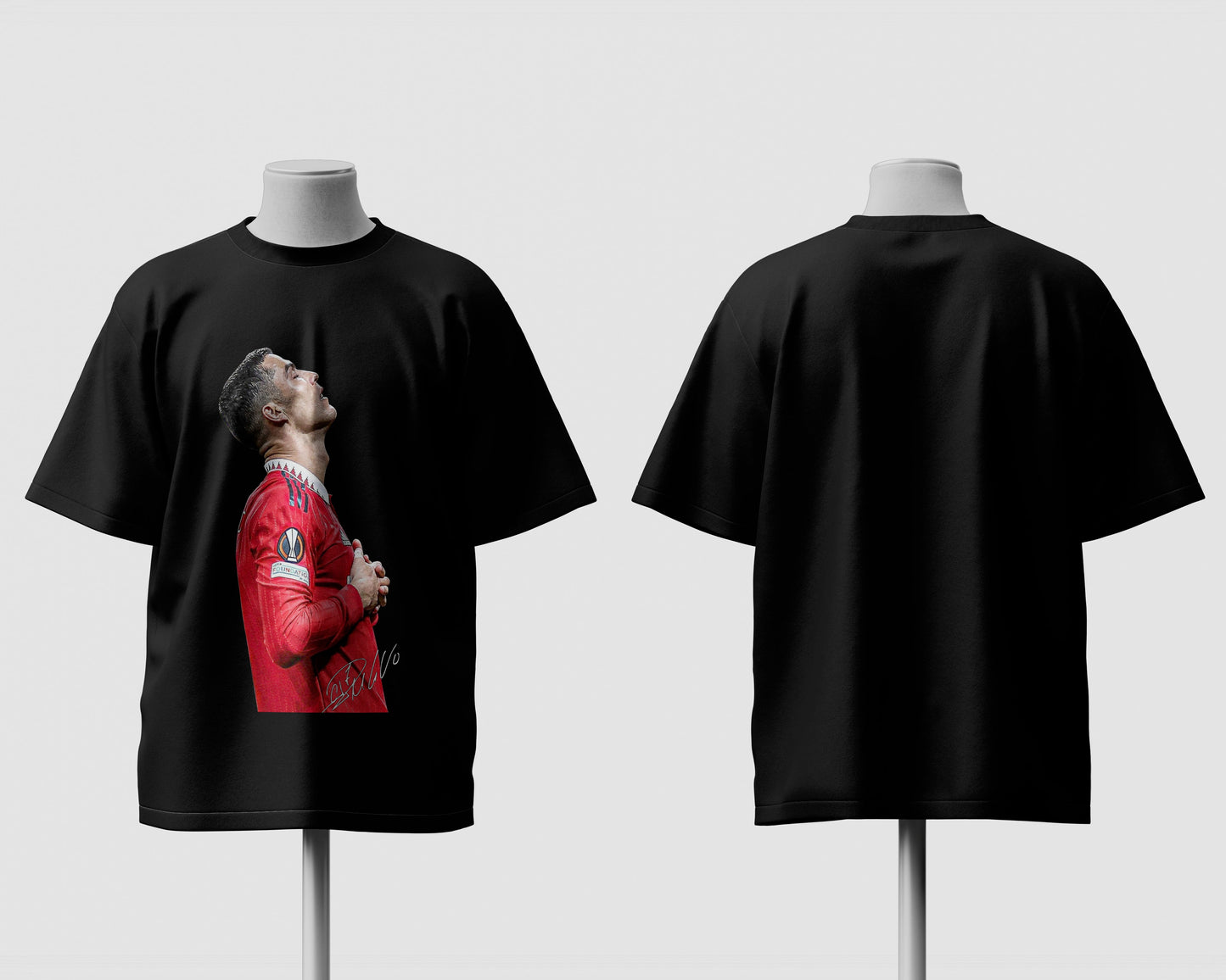 Black t-shirt with a graphic of a person in a red outfit on a mannequin against a white background