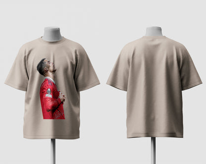 Beige t-shirt with a graphic of a person in a red jacket on a white background