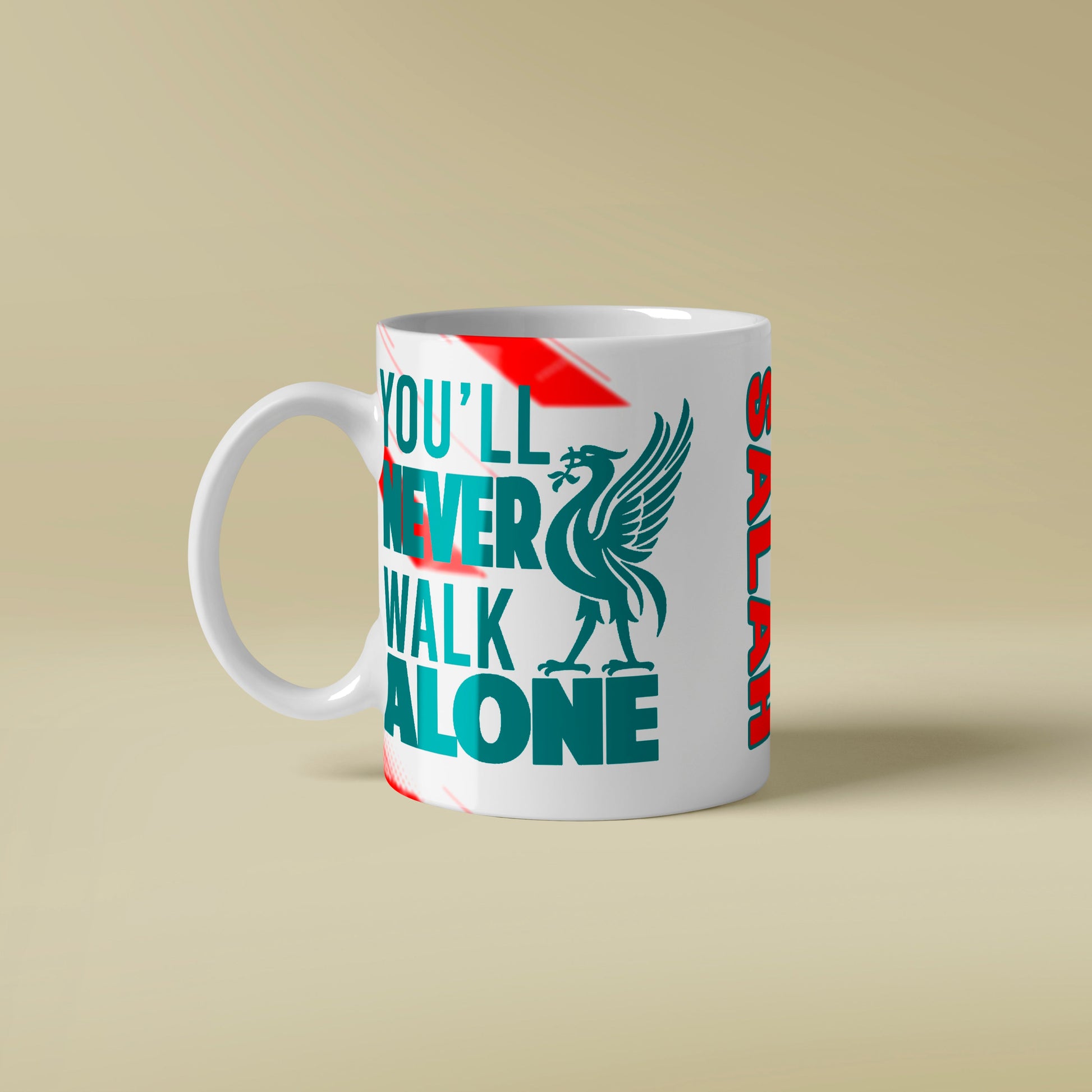 Mug with 'You'll Never Walk Alone' text and logo on a beige background